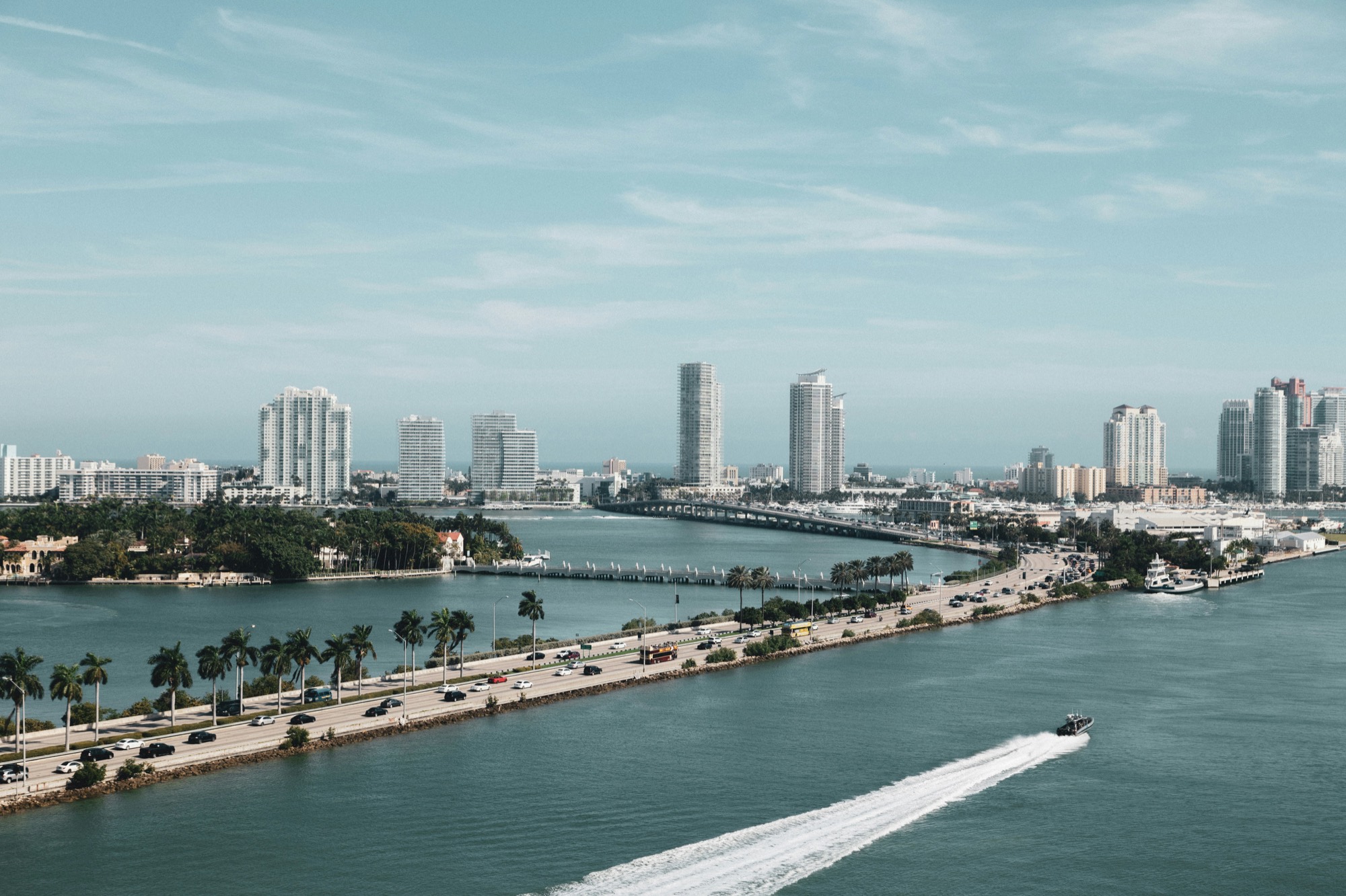 Aerial view of Miami's causeway, bay and skyline by day